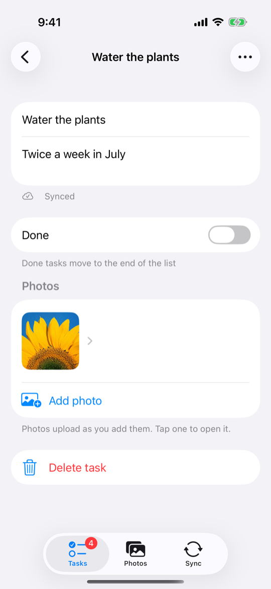 A synced task's screen: the title and notes, the Done switch, the Photos section with one uploaded photo and Add photo, and Delete task